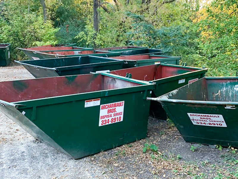 Commercial dumpsters stored at the Archambault Brothers Disposal headquarters